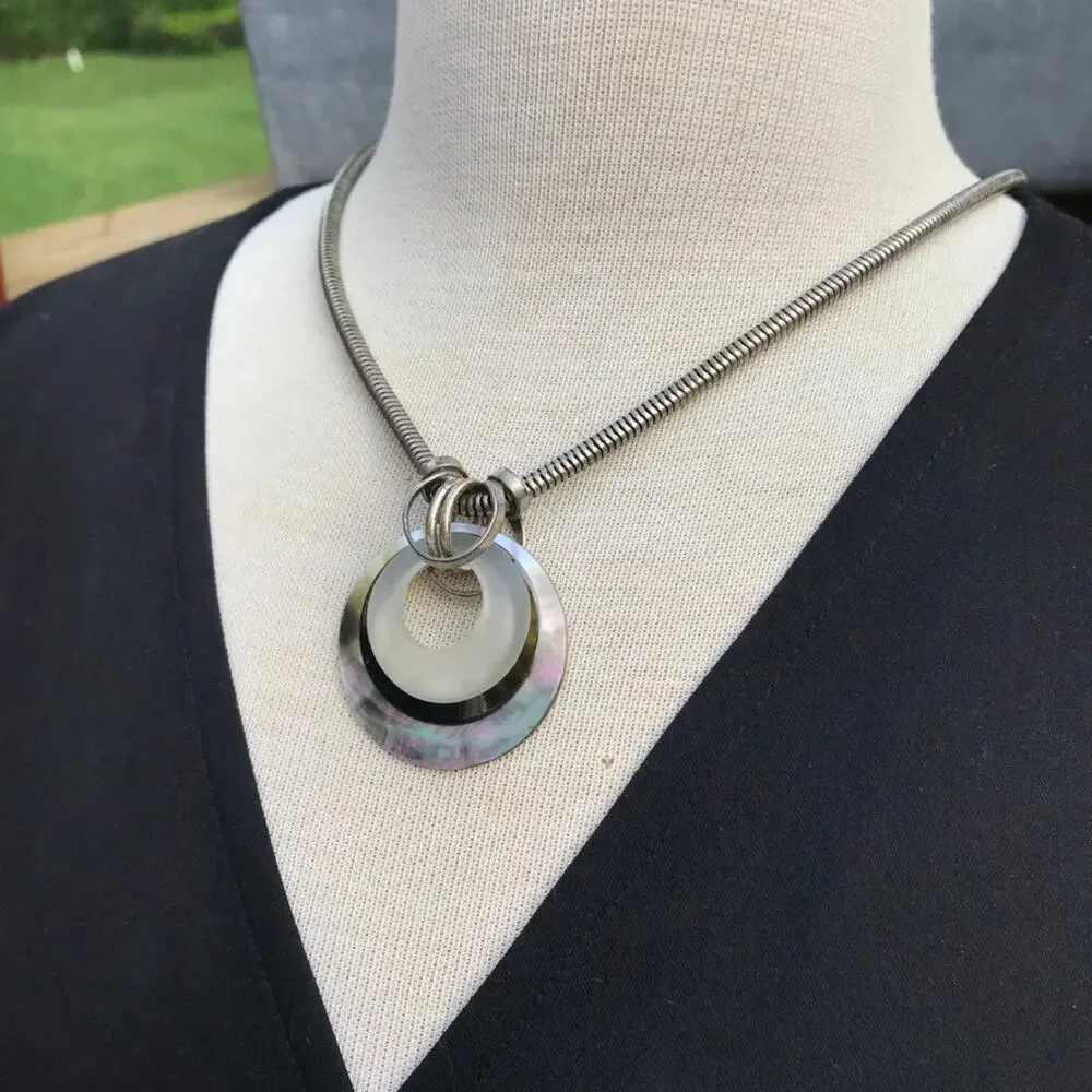 Mother of pearl mixed materials circle pendant silver tone necklace